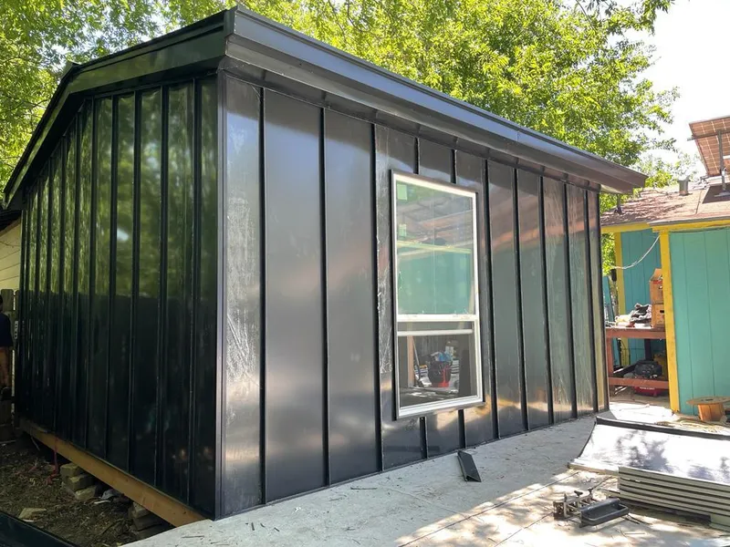 Black standing seam metal wall panels for Roof Inspection in Gadsden